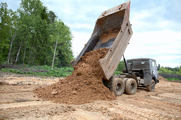 istock dump-body truck unloads a ground 115751768