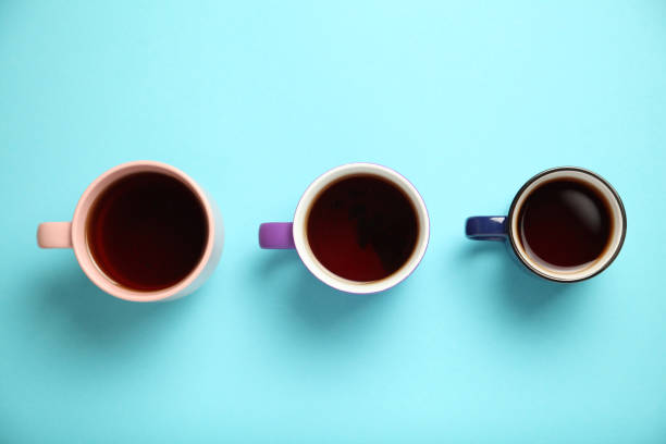 istock Black tea (coffee) in bright cups, office break, team building 1157519367