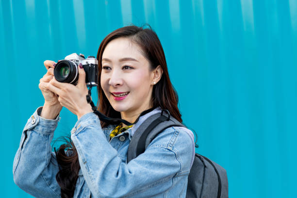 istock Women taking photos with a SLR camera 1157519410