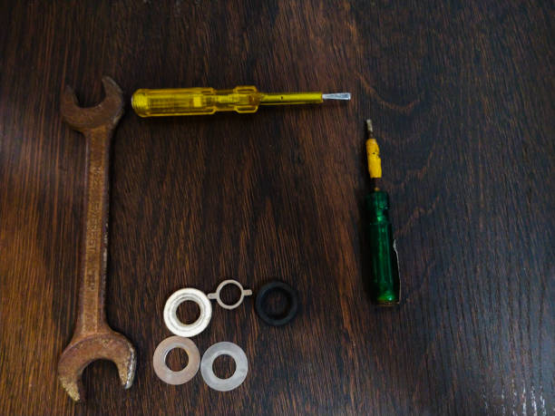 istock screw driver tool kit on wooden desk 1157519805