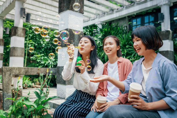 Young Taiwanese and Chinese women spending time together and enjoying their leisure time and activities.
