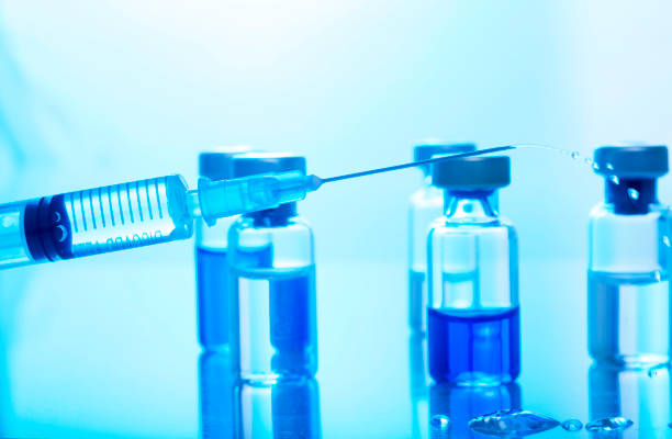 istock High Angle View Of Syringe With Medical Bottles On Table 1157524996