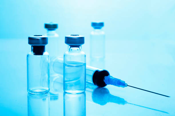 istock High Angle View Of Syringe With Medical Bottles On Table 1157526064