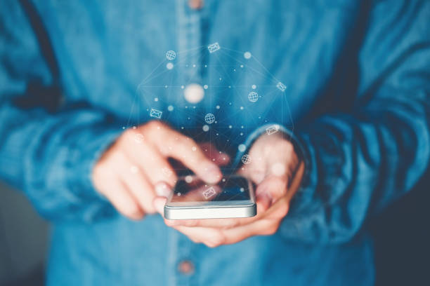 istock Businessman using mobile online icon social networking connection on screen 1157527284
