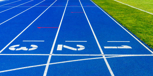 istock Numbers On Running Track By Grass In Stadium 1157528375