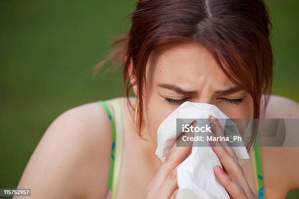 Sneezing Woman Stock Photo - Download Image Now - Adult, Allergy, Blossom