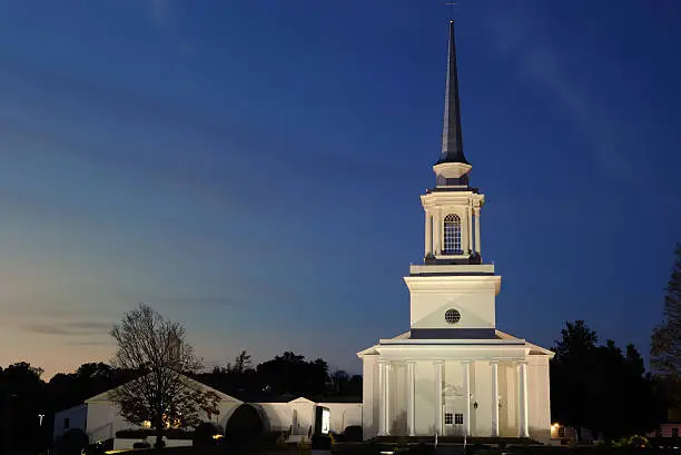 A Southern Baptist Church illuminated at twilght.