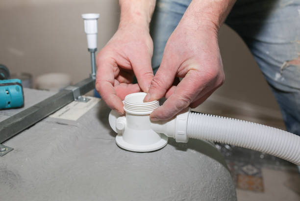 istock Bath installation. Worker is making fastener. Maintenance repair in the flat. Renovation process. 1157534799