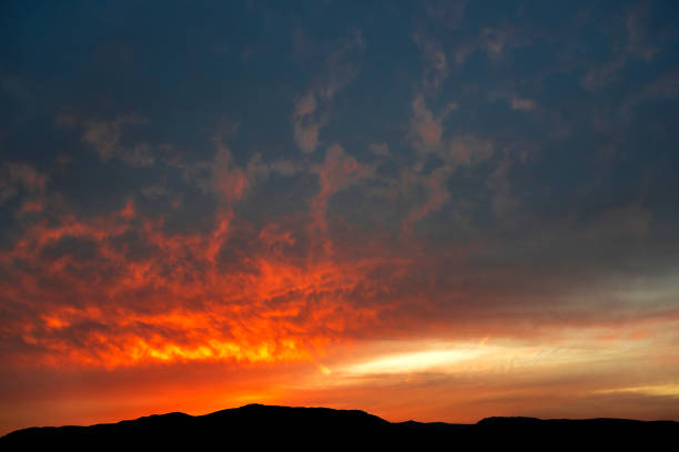 istock Cloudscape with dramatic sky and mountains range at sunset in Chios Island, Greece 1157535825