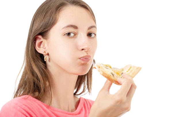 istock girl with pizza 1157544079