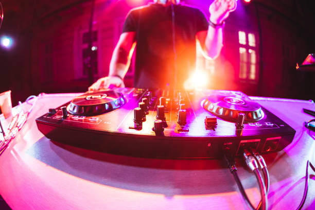 DJ playing and mixing music at party