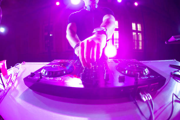 istock DJ playing and mixing music at party 1157544530