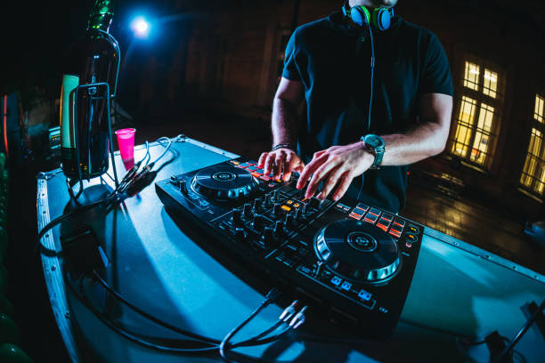 istock DJ playing and mixing music at party 1157545911