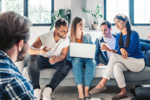 istock four young people looking together at laptop 1157546627