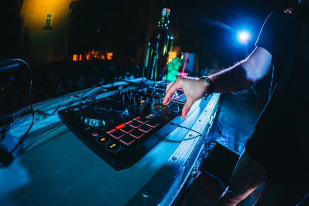 istock DJ playing and mixing music at party 1157546642