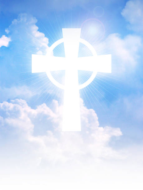 istock Cross of Christianity symbol on clouds 1157546831