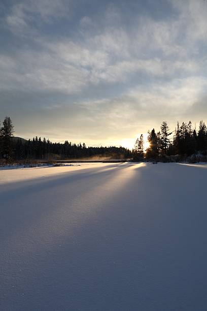 istock Sunset on a frozen lake. 115755102