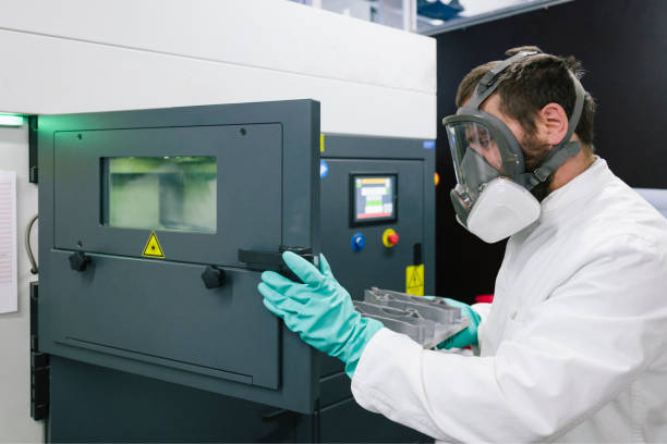 istock 3d printing: Scientist work on a SLM machine (Selective Laser Melting) for metal 1157551644