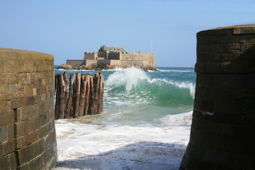Le Fort National de St Malo, Brittany, France as viewed through the Chaussée du Sillon seawall at high tide.