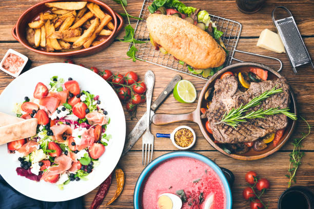 Different food cooked on a wooden table