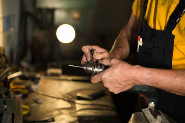 istock Mechanic is about to use his drilling tool 1157555734