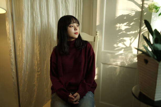 asian woman in her room
