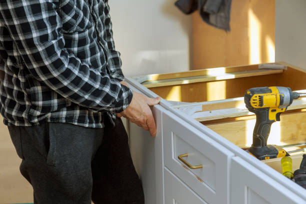 istock Assembling furniture white large trash can screws using a screwdriver. 1157557991