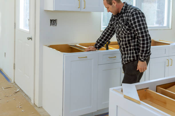 istock A carpenter is building a drawers garbage bin in the kitchen 1157557994