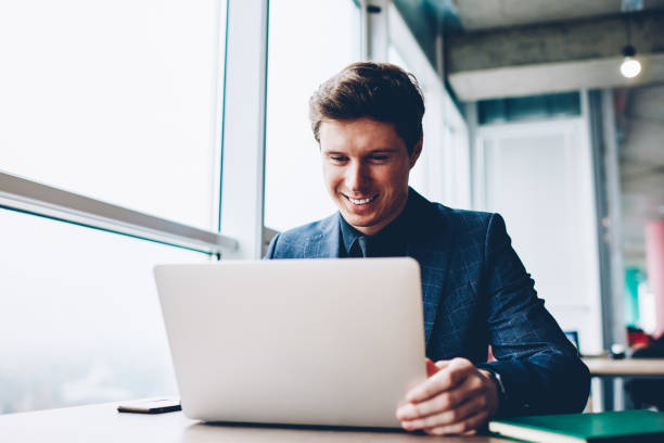 istock Professional executive manager satisfied with successful project checking financial news on exchange website using laptop computer,formally dressed businessman satisfied with updating software for job 1157559486