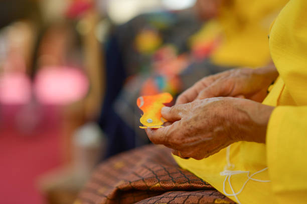 istock Woman sewing folding paper fan. 1157559785
