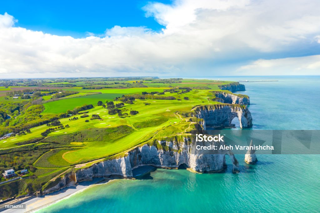 Picturesque panoramic landscape on the cliffs of Etretat. Natural amazing cliffs. Etretat, Normandy, France, La Manche or English Channel. Coast of the Pays de Caux area in sunny summer day. France Picturesque panoramic landscape on the cliffs of Etretat. Natural amazing cliffs. Etretat, Normandy, France, La Manche or English Channel. France Normandy Stock Photo