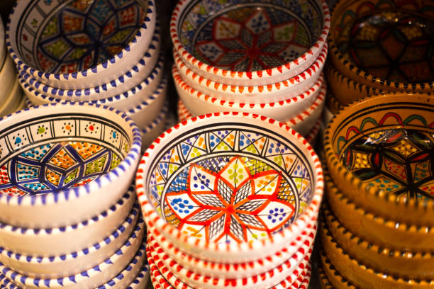 Sicilian ceramic colorful decorative bowls on a yellow sheet
