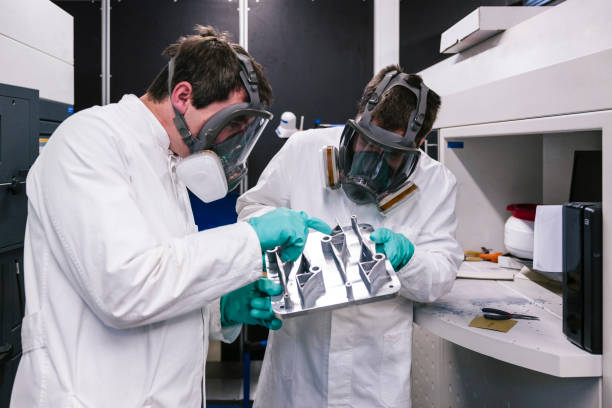 3d printing: two Scientists work on a SLM machine (Selective Laser Melting) for metal Selective laser melting, direct metal laser sintering, 3d printing, industry 4.0 3d printing lab stock pictures, royalty-free photos & images