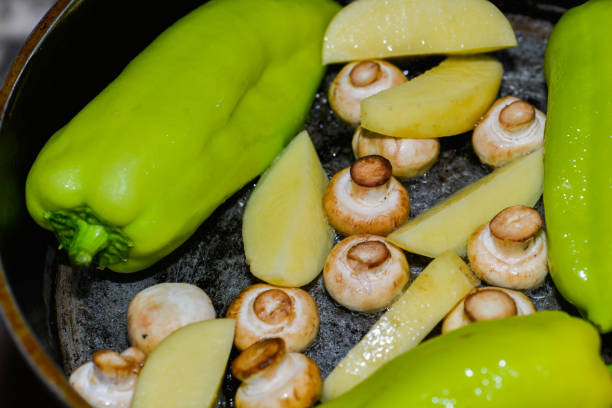 The Fried mixture of potatoes,mushrooms and papper.