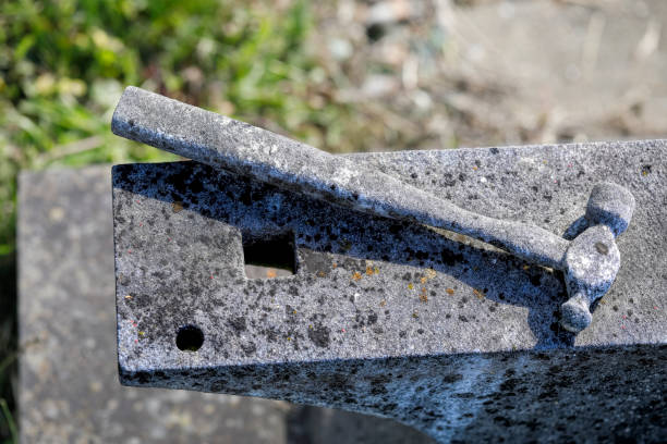 This stone hammer and anvil is part of a tombstone memorial commemorating a Surrey blacksmith born in England in 1841.