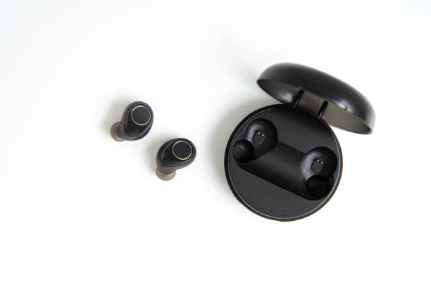 istock Black true wireless earbuds with power bank case on the white isolated background 1157568655