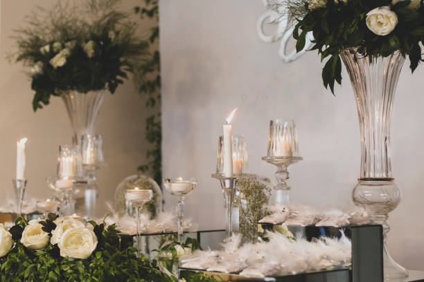 istock flowers and candles on the decorated table 1157570223