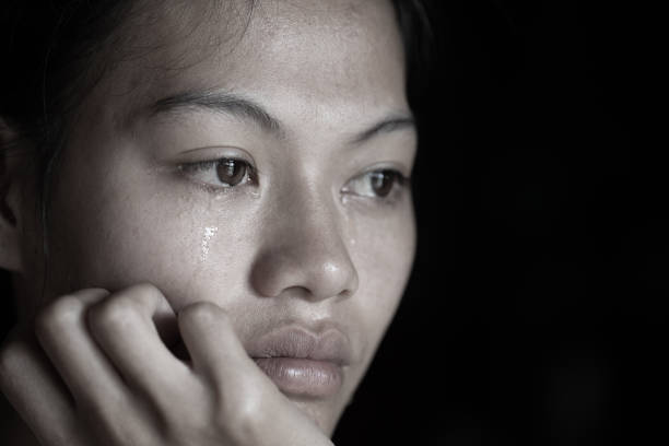 istock Women sitting on the floor crying with depression 1157570999