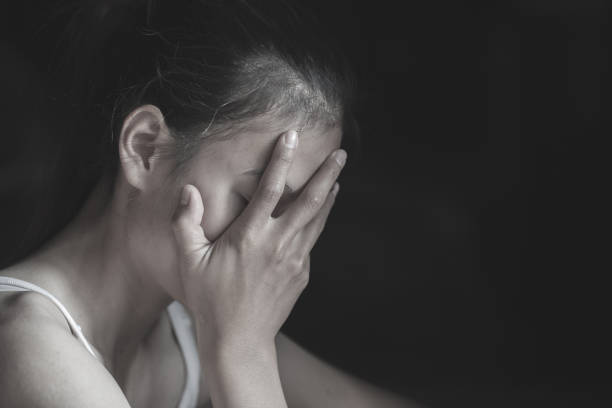 istock Women sitting on the floor crying with depression 1157571006