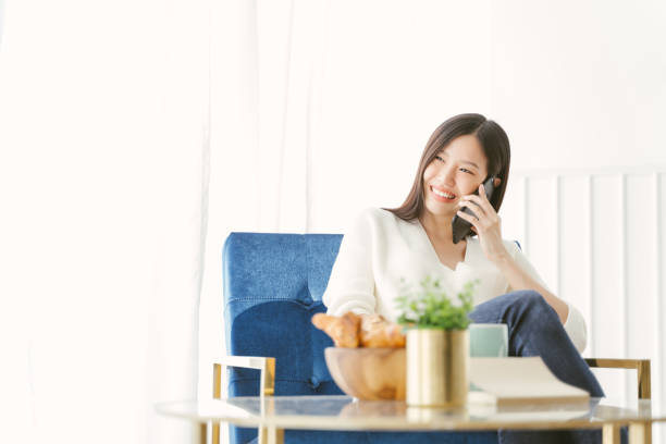 istock Young Asian woman using phone talking happy and smile. 1157571532