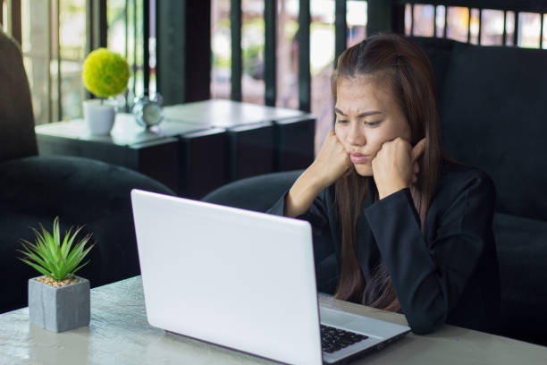 istock Business Woman Having Headache While Working Using Laptop Computer. Stressed And Depressed Girl Touching Her Head,  Work Failure Concept. 1157572696