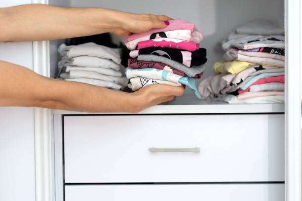 istock Woman hands holding stack colorful linen textiles clothing. 1157576885
