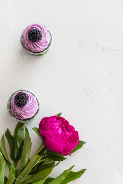 Pink Muffins With Peonies On A White Background Stock Photo - Download ...
