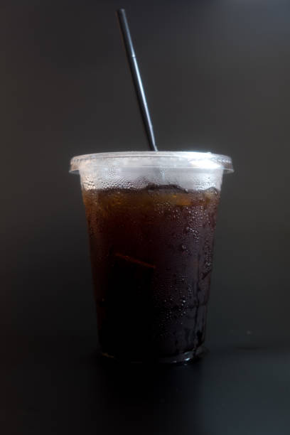 istock Ice black coffee in transparent glass with black straw 1157577201