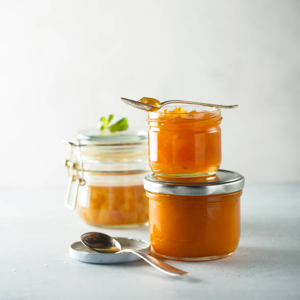 atolamento caseiro do damasco - gelatin dessert orange fruit marmalade - fotografias e filmes do acervo