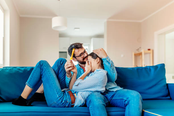 istock Happy Couple With Positive Pregnancy Test 1157582854