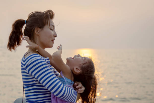 istock beautiful moment with mom and kid play and hug 1157584371