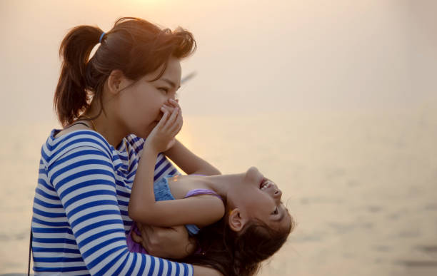 istock beautiful moment with mom and kid play and hug 1157584376