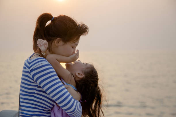 istock beautiful moment with mom and kid play and hug 1157584377