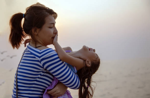 istock beautiful moment with mom and kid play and hug 1157584383